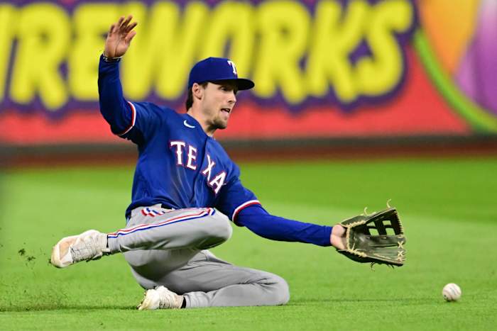 Sep 16, 2023; Cleveland, Ohio, USA; Texas Rangers left fielder Evan Carter (32) can not make the catch of a ball hit by Cleveland Guardians batterTyler Freeman (not pictured) during the eighth inning at Progressive Field. Mandatory Credit: Ken Blaze-USA TODAY Sports